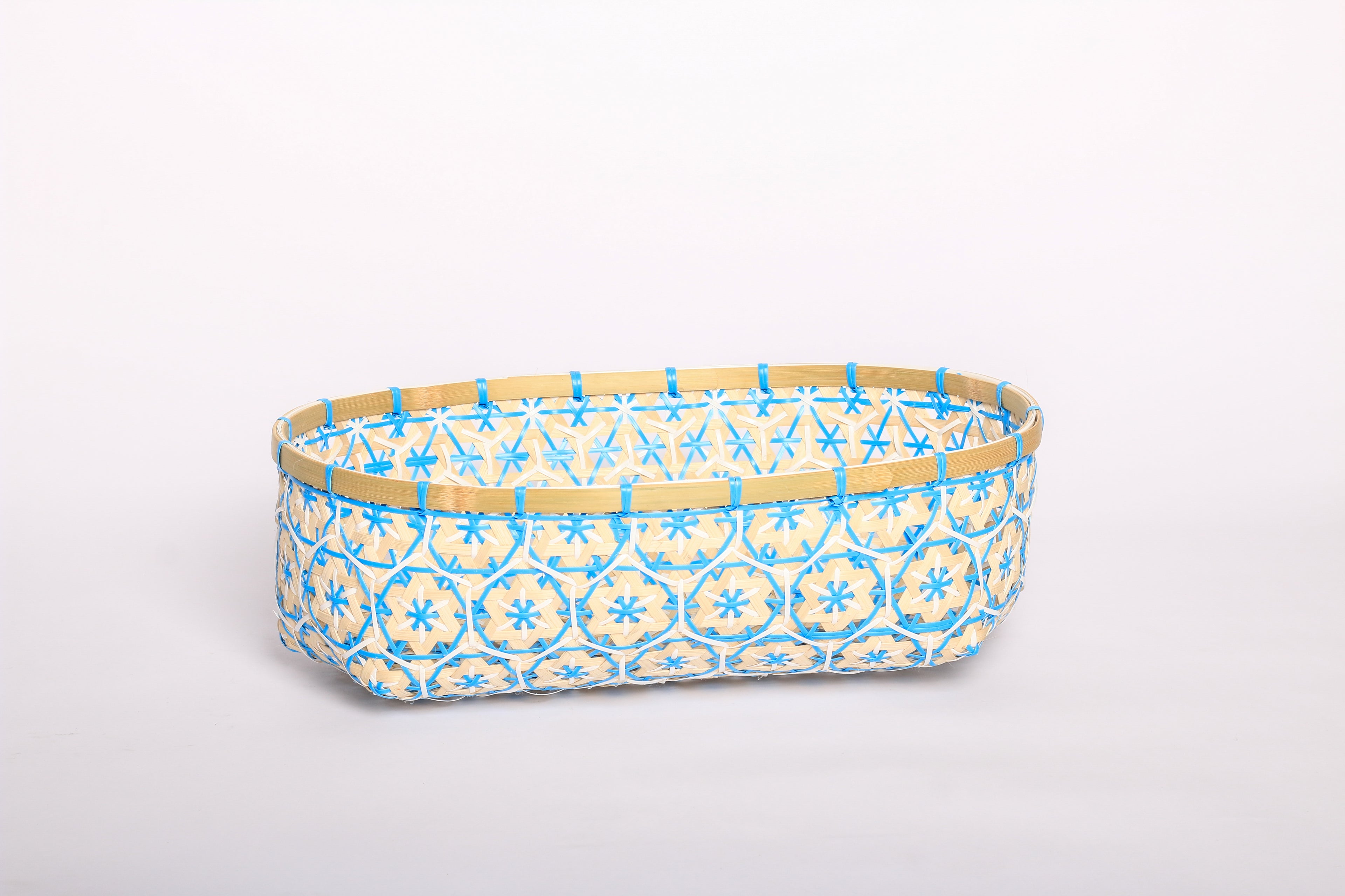 Blue Faustina Festive Star Bread and Fruit Basket made from 100% natural plant fiber, featuring a celestial star motif. Perfect for organizing bread, fruits, and essentials while adding a decorative touch to your home. Sustainable design for eco-friendly living.