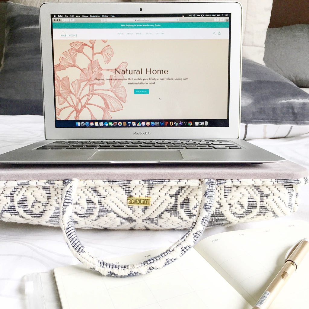 Handwoven Hazel Laptop Pillow made from Abel Iloco fabric, featuring geometric patterns inspired by nature, offering comfort and cultural heritage with a soft, durable design perfect for home or office use.