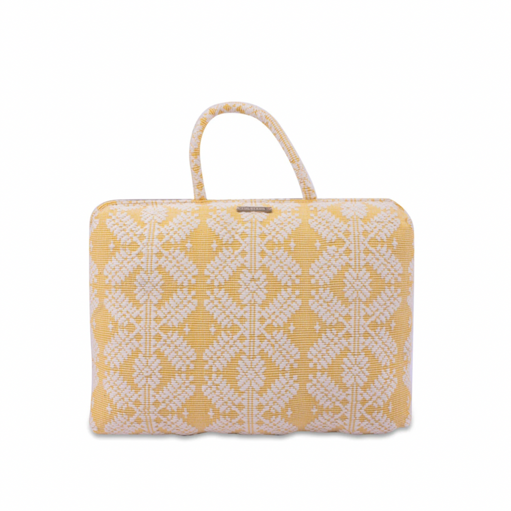Handwoven Hazel Laptop Pillow Yellow Snowflakes made from Abel Iloco fabric, featuring geometric patterns inspired by nature, offering comfort and cultural heritage with a soft, durable design perfect for home or office use.