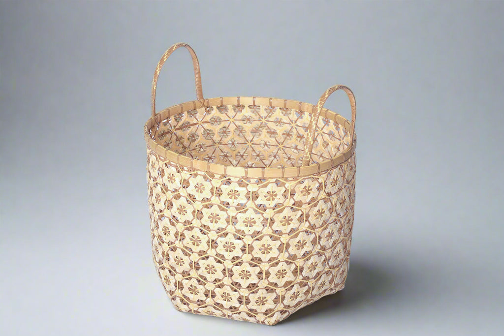 Faustina Nude Festive Star Laundry Hamper crafted from 100% natural plant fiber, featuring a celestial star motif that transforms a functional item into a decorative accent. Durable and eco-friendly, this hamper enhances your living space while supporting sustainable craftsmanship.