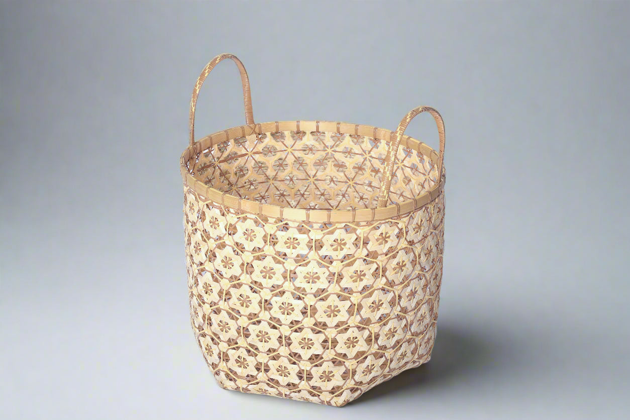 Faustina Nude Festive Star Laundry Hamper crafted from 100% natural plant fiber, featuring a celestial star motif that transforms a functional item into a decorative accent. Durable and eco-friendly, this hamper enhances your living space while supporting sustainable craftsmanship.