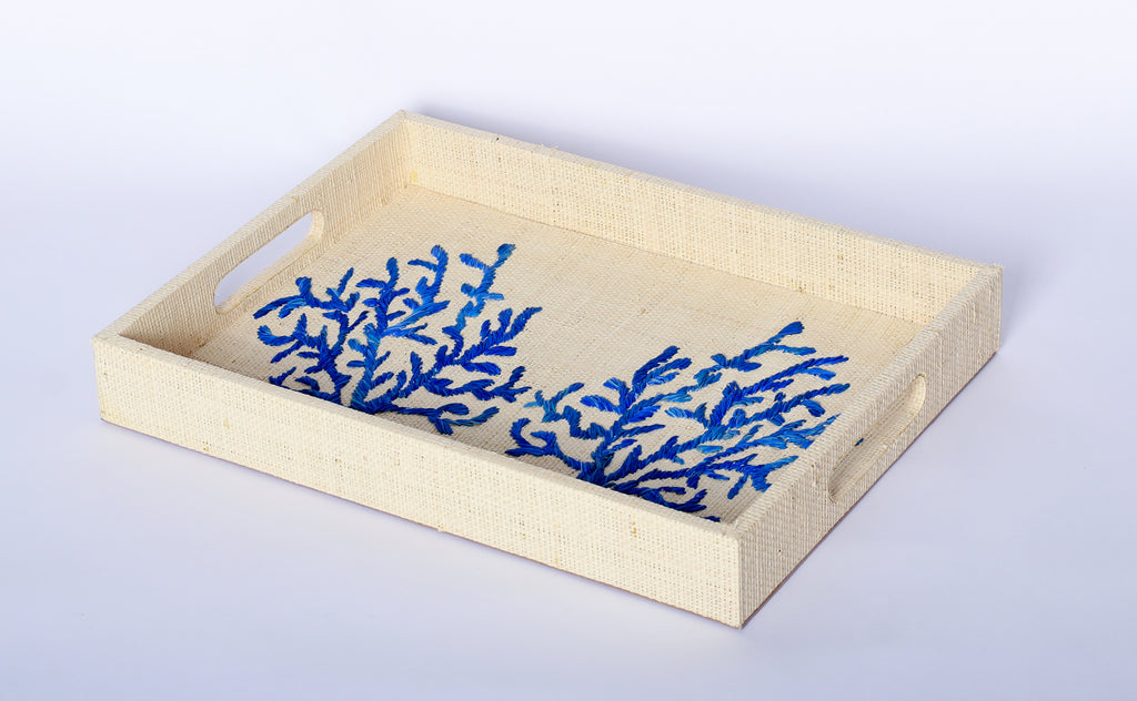 Elevate your home decor with Penelope Coral Blue Embroidered Trays made from eco-friendly raffia. Featuring elegant embroidery, these versatile trays serve as both functional and stylish accents for organizing or serving.