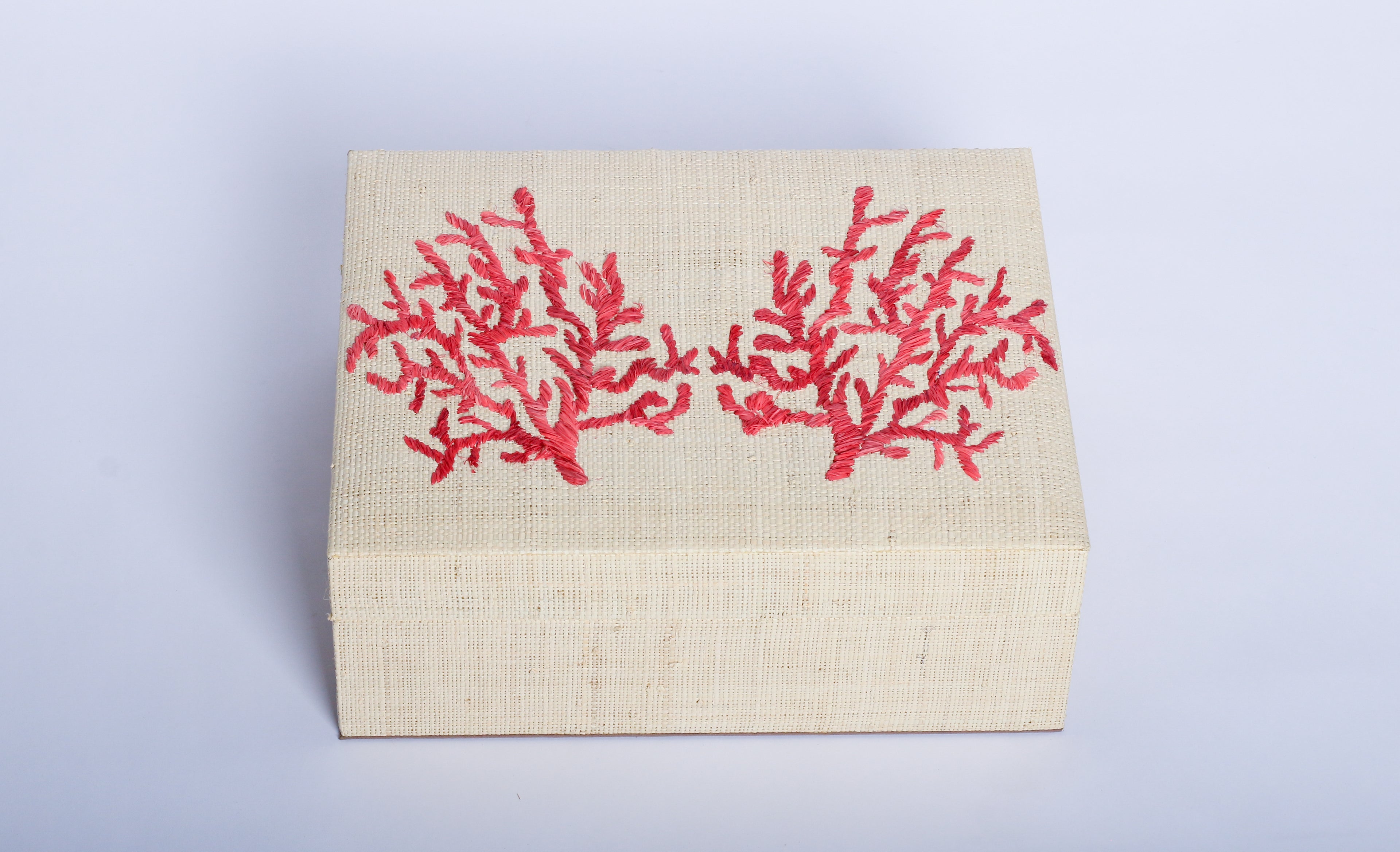 Store your jewelry in style with the Penelope Coral Red Embroidery Jewelry Box. Made from eco-friendly materials and featuring intricate embroidery, this sustainable box combines function and elegance for your vanity or dresser.