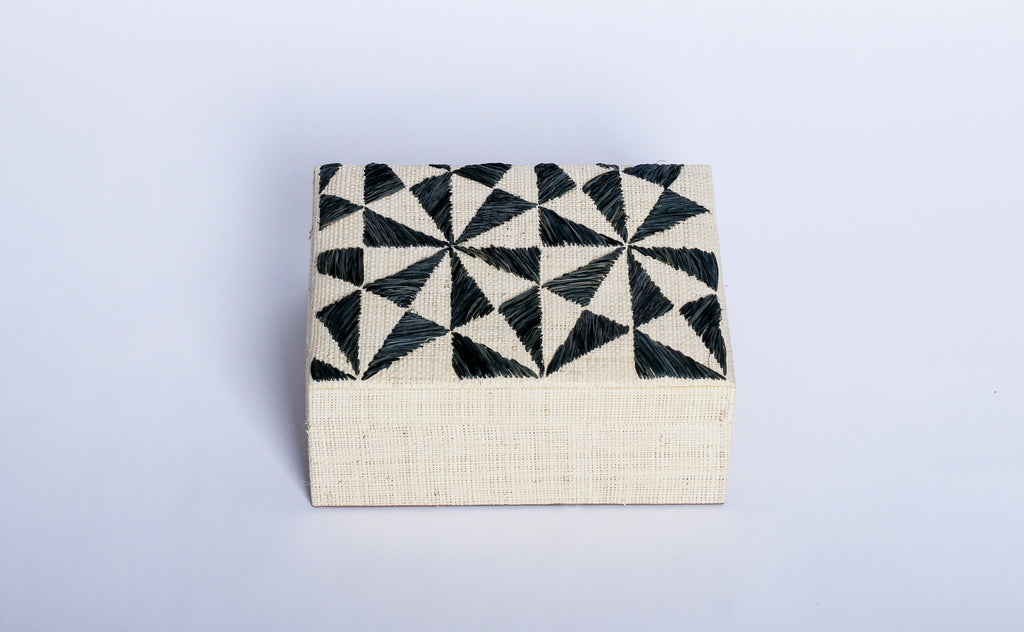 Store your jewelry in style with the Penelope Geometric Triangles Embroidery Jewelry Box. Made from eco-friendly materials and featuring intricate embroidery, this sustainable box combines function and elegance for your vanity or dresser.