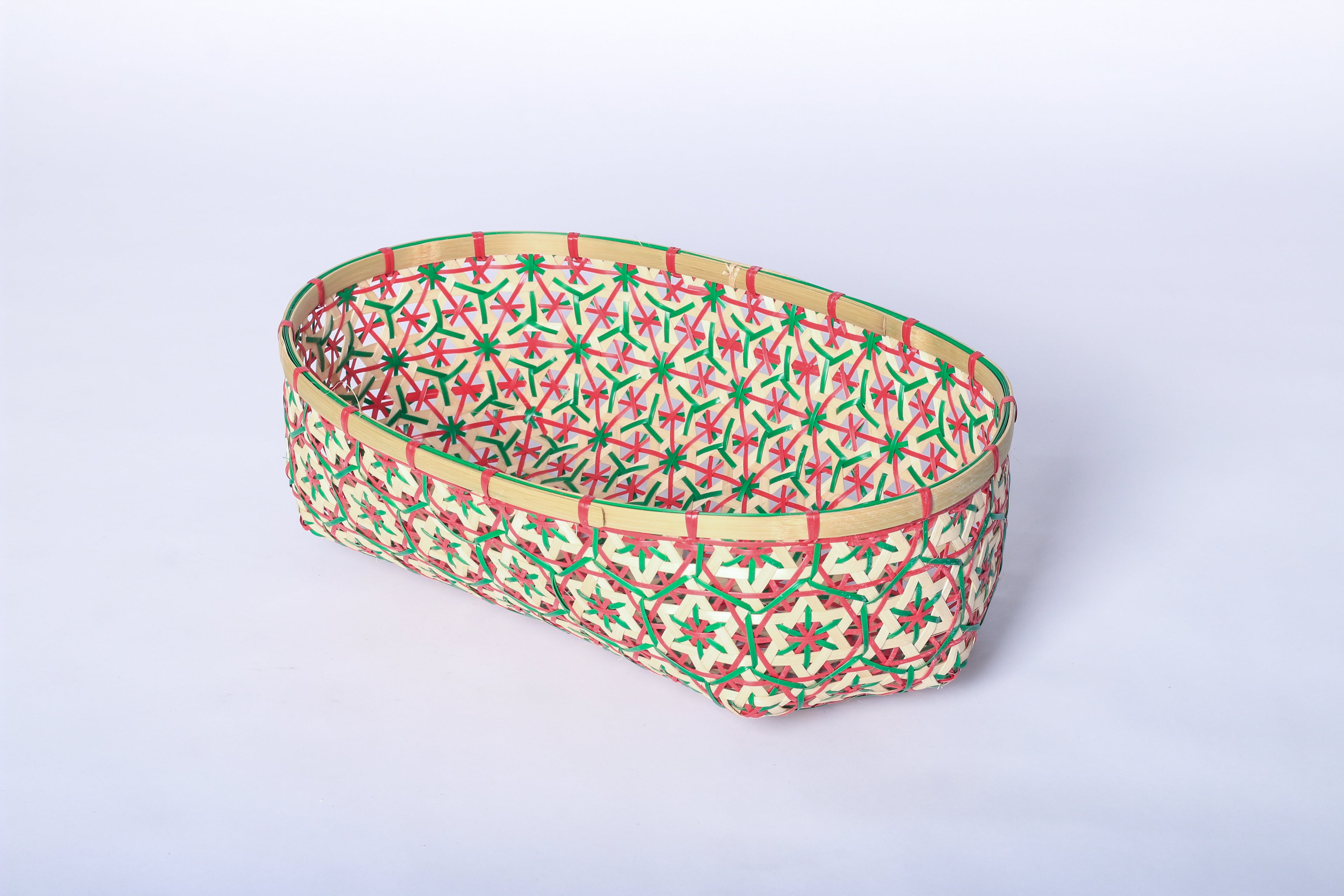 Red and Green Faustina Festive Star Bread and Fruit Basket made from 100% natural plant fiber, featuring a celestial star motif. Perfect for organizing bread, fruits, and essentials while adding a decorative touch to your home. Sustainable design for eco-friendly living.