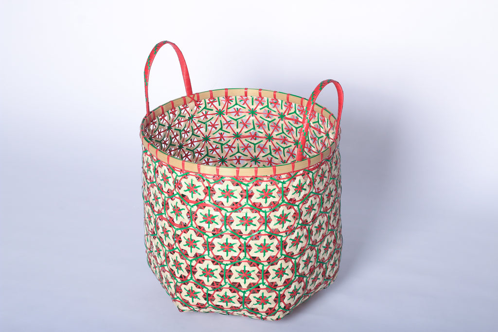 Faustina Red Festive Star Laundry Hamper crafted from 100% natural plant fiber, featuring a celestial star motif that transforms a functional item into a decorative accent. Durable and eco-friendly, this hamper enhances your living space while supporting sustainable craftsmanship.