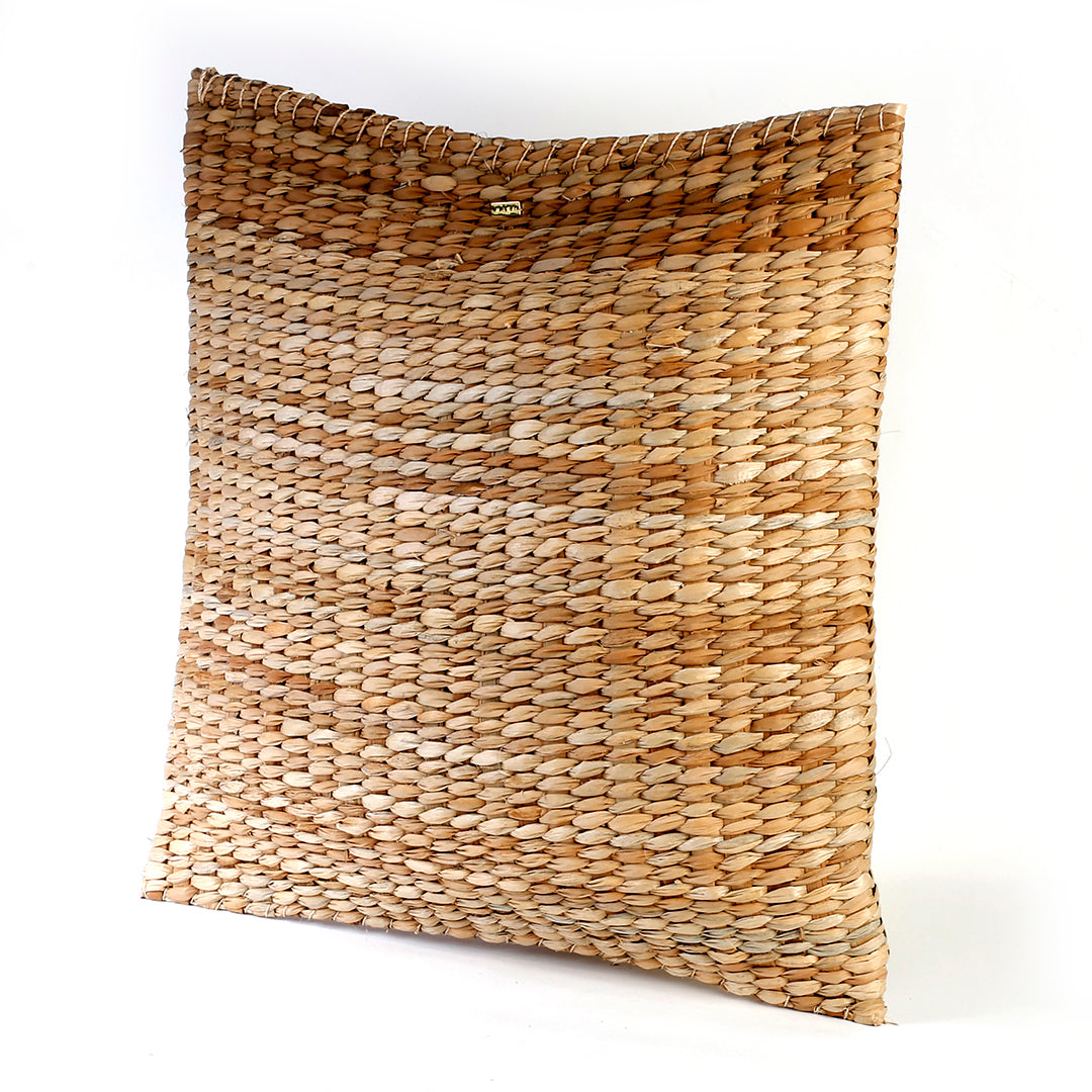 Carol Seagrass Floor Pillow, crafted from 100% natural seagrass, offers eco-friendly comfort and rustic elegance to any living space. This lightweight, beautifully textured floor pillow adapts to various lifestyles, whether placed on a rattan bench or used for casual lounging on the floor. Its earthy tones complement multiple decor styles, including bohemian and coastal, making it a stunning accent piece that sparks conversations among guests. Care instructions recommend avoiding prolonged moisture exposure