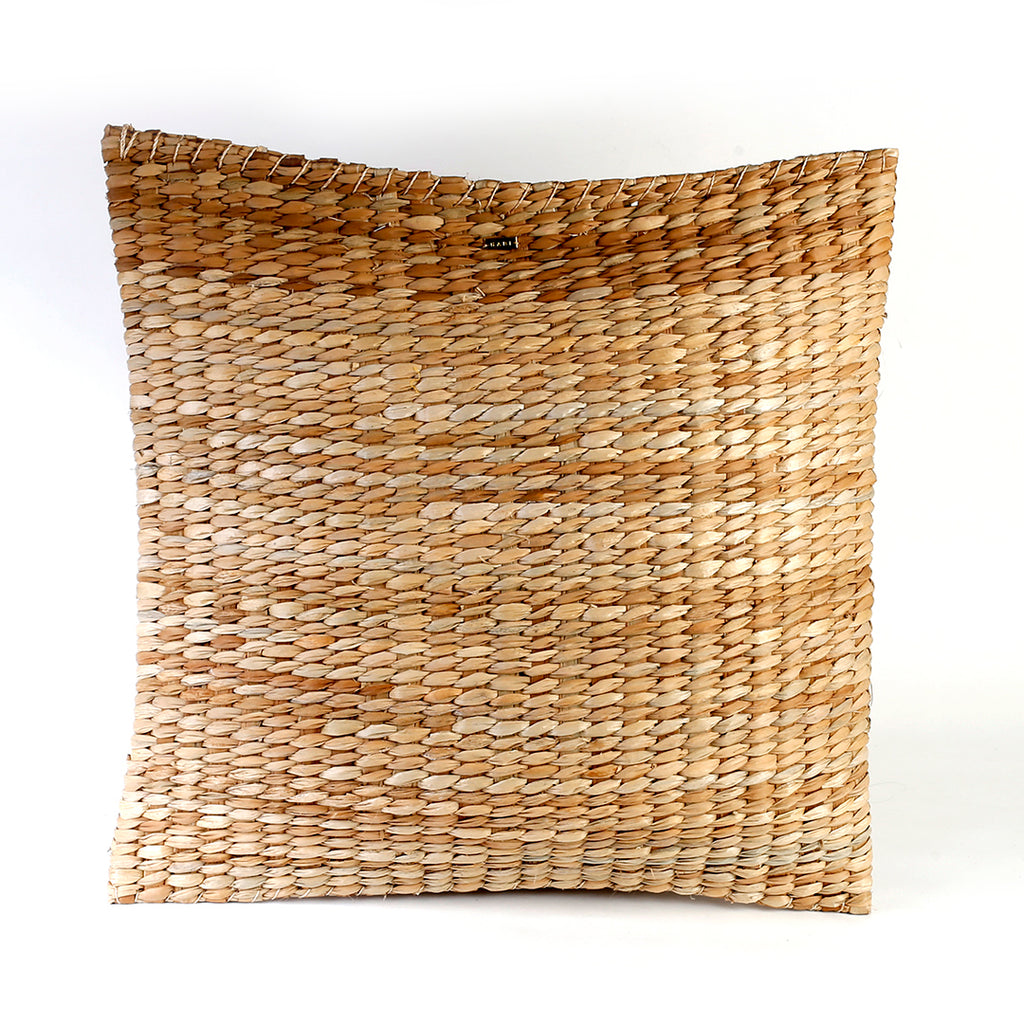 Carol Seagrass Floor Pillow, crafted from 100% natural seagrass, offers eco-friendly comfort and rustic elegance to any living space. This lightweight, beautifully textured floor pillow adapts to various lifestyles, whether placed on a rattan bench or used for casual lounging on the floor. Its earthy tones complement multiple decor styles, including bohemian and coastal, making it a stunning accent piece that sparks conversations among guests. Care instructions recommend avoiding prolonged moisture exposure