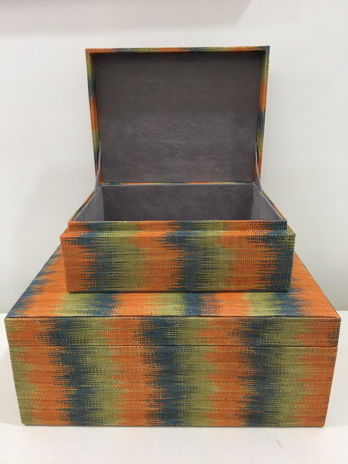 Chloe Storage Boxes Set of 2 in Orange Combi, made from 100% natural plant fiber and T'boli tinalak fabric, perfect for eco-friendly organization.