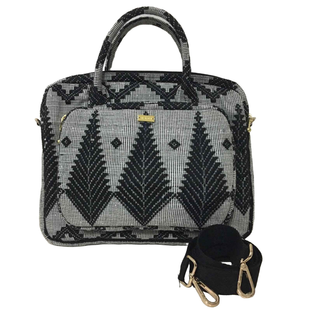 Dani Inabel Black Feather Laptop Bag, handwoven from Abel Iloco fabric in the Philippines, showcasing intricate geometric patterns inspired by nature. This eco-friendly laptop bag blends traditional craftsmanship and functionality, crafted by skilled Ilocos artisans using centuries-old weaving techniques. Made with 50% cotton and 50% polyester, the bag offers durability with a removable, adjustable cotton strap. 