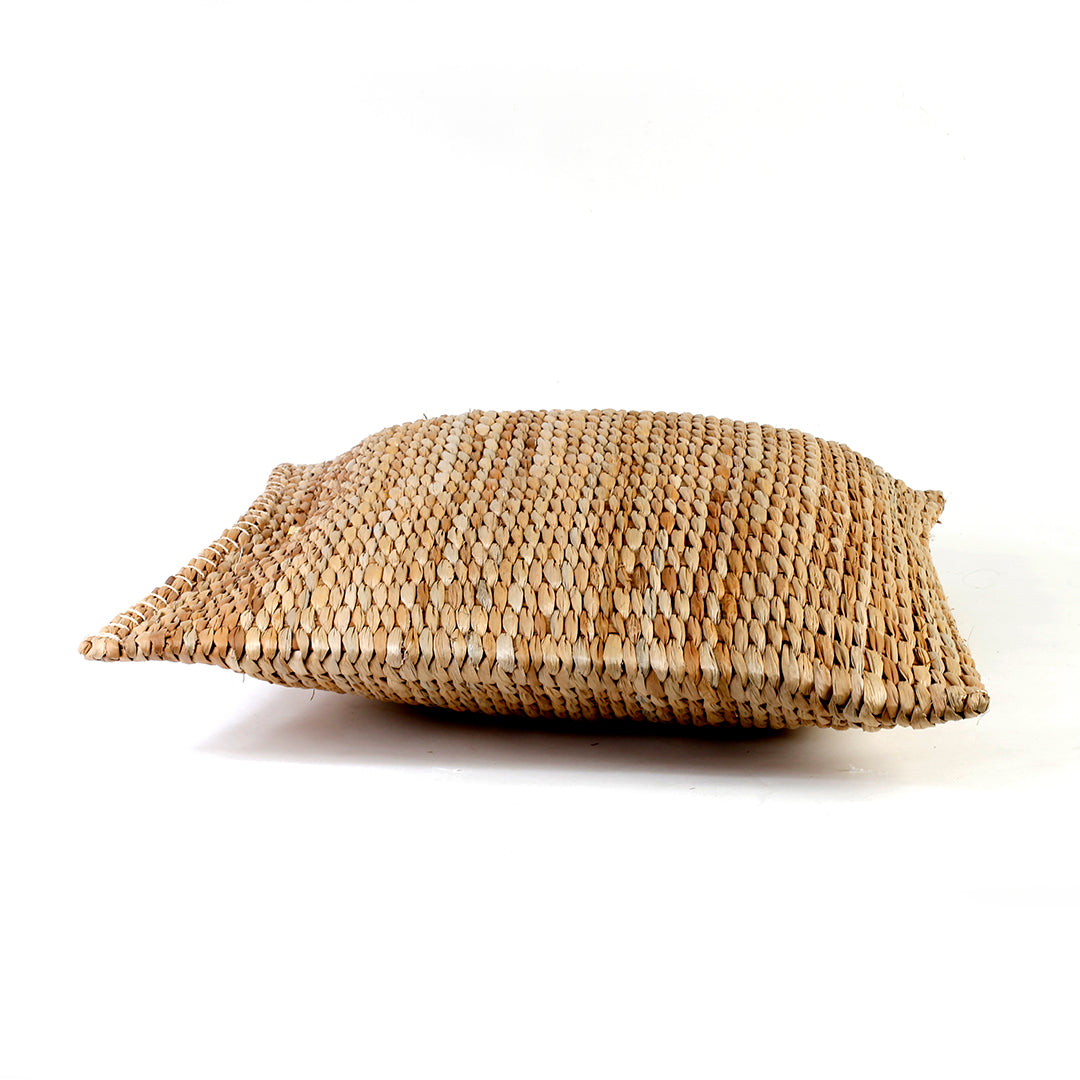 Carol Seagrass Floor Pillow, crafted from 100% natural seagrass, offers eco-friendly comfort and rustic elegance to any living space. This lightweight, beautifully textured floor pillow adapts to various lifestyles, whether placed on a rattan bench or used for casual lounging on the floor. Its earthy tones complement multiple decor styles, including bohemian and coastal, making it a stunning accent piece that sparks conversations among guests. Care instructions recommend avoiding prolonged moisture exposure