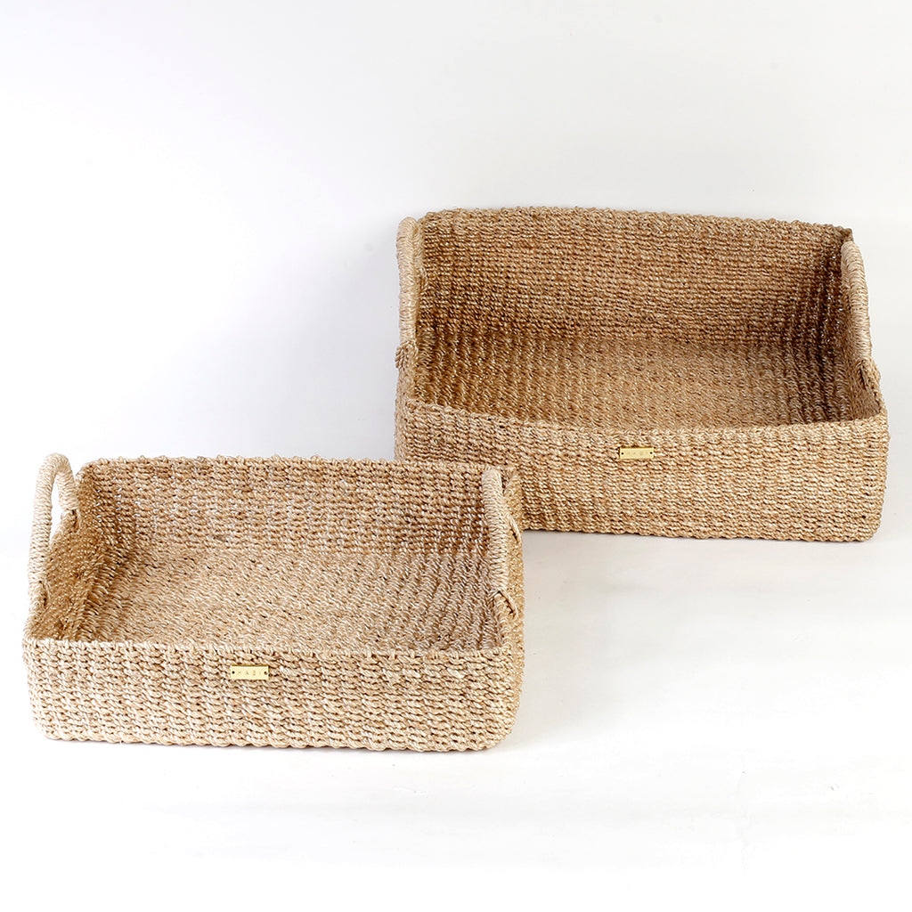 Elevate your home organization with the Stephanie Trays Set of 2. Handwoven from 100% natural plant fiber, these eco-friendly trays offer chic and sustainable storage solutions for any room, enhancing your decor with natural elegance.