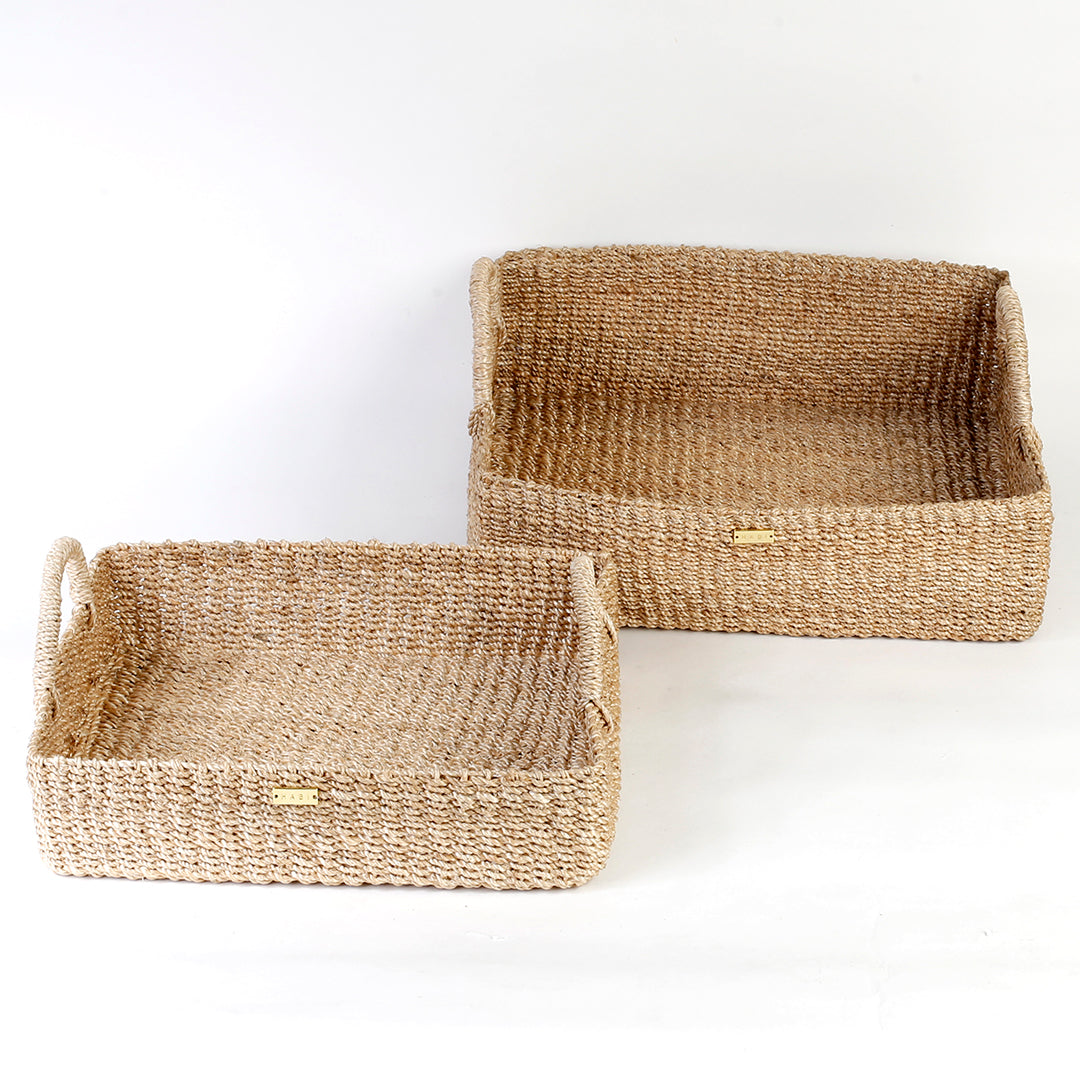 Elevate your home organization with the Stephanie Trays Set of 2. Handwoven from 100% natural plant fiber, these eco-friendly trays offer chic and sustainable storage solutions for any room, enhancing your decor with natural elegance.