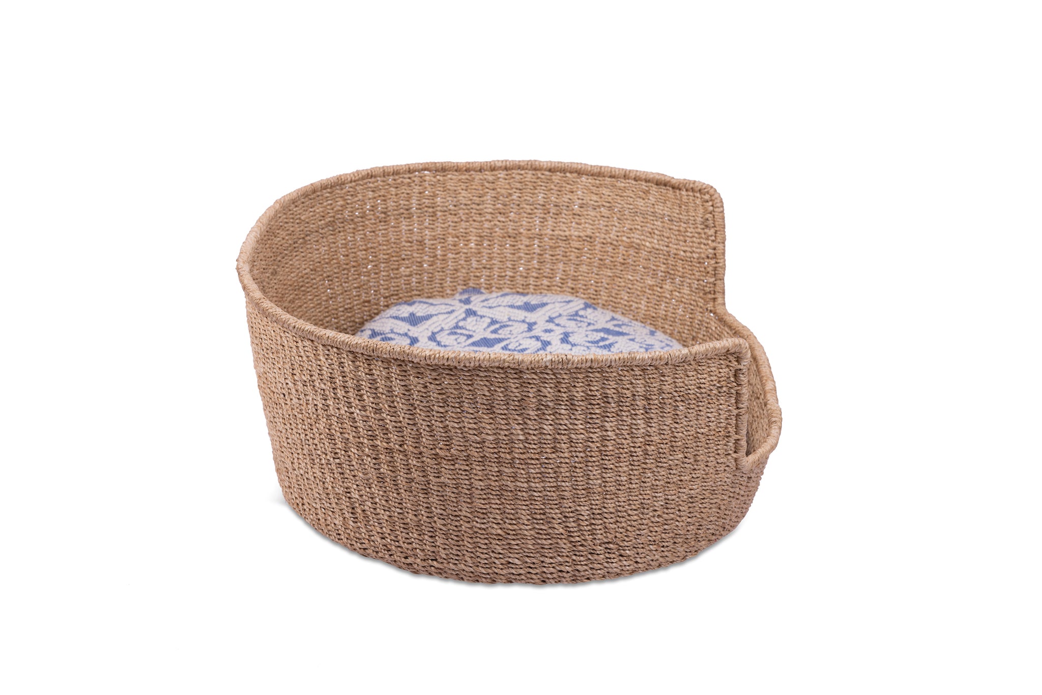 Eco-friendly Tippy Pet Bed made from 100% natural plant fiber with a stylish Inabel handwoven fabric cushion. Perfect for small dogs and cats, offering comfort and sophistication for modern Filipino interiors.