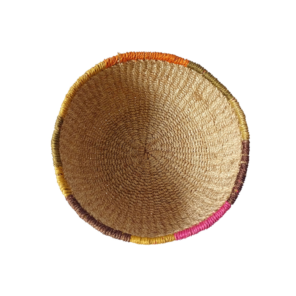 Mae Colorful Edge Fruit Bowl, handcrafted from 100% natural abaca with vibrant, dyed edges. Eco-friendly, versatile, and perfect for displaying fruit, serving snacks, or adding a decorative touch to any room.