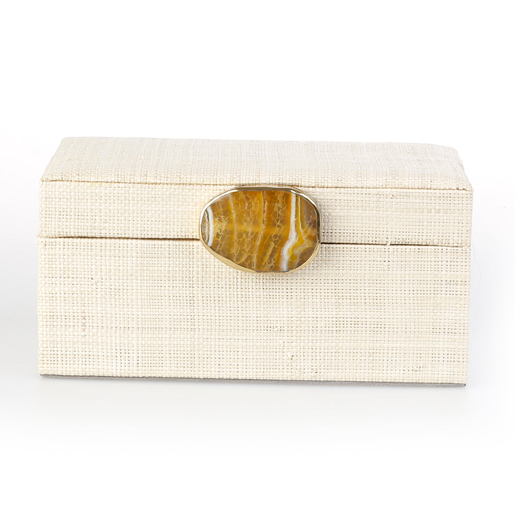 Karuna Raffia Jewelry Box, handcrafted from 100% natural raffia with a polished agate stone accent and hand-tooled brass detailing. Elegant, eco-friendly storage for jewelry and keepsakes.