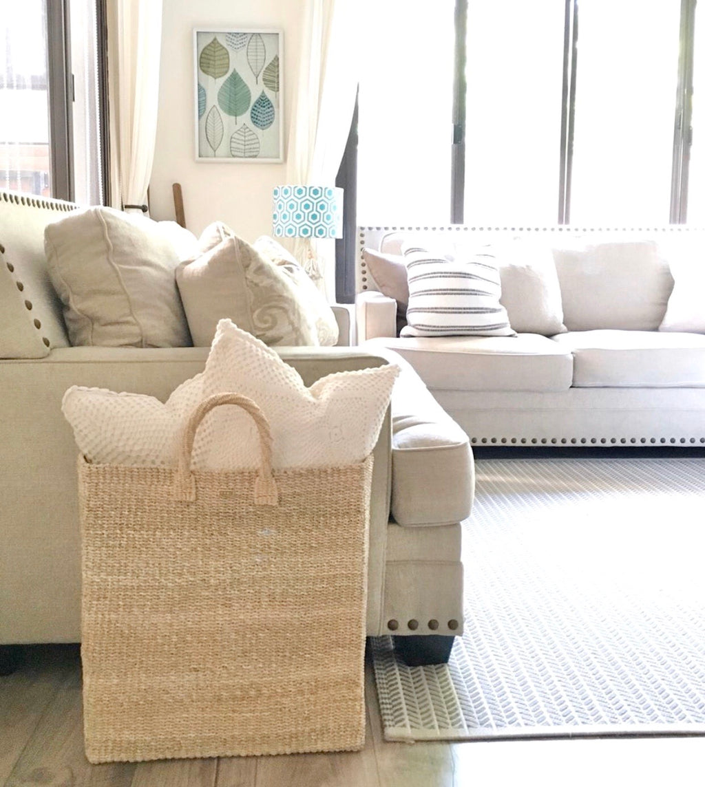 Keep your home organized with the Serene Rectangle Storage Basket. Handwoven from 100% natural plant fiber, this eco-friendly, stylish storage solution is perfect for laundry, sports gear, or seasonal items.