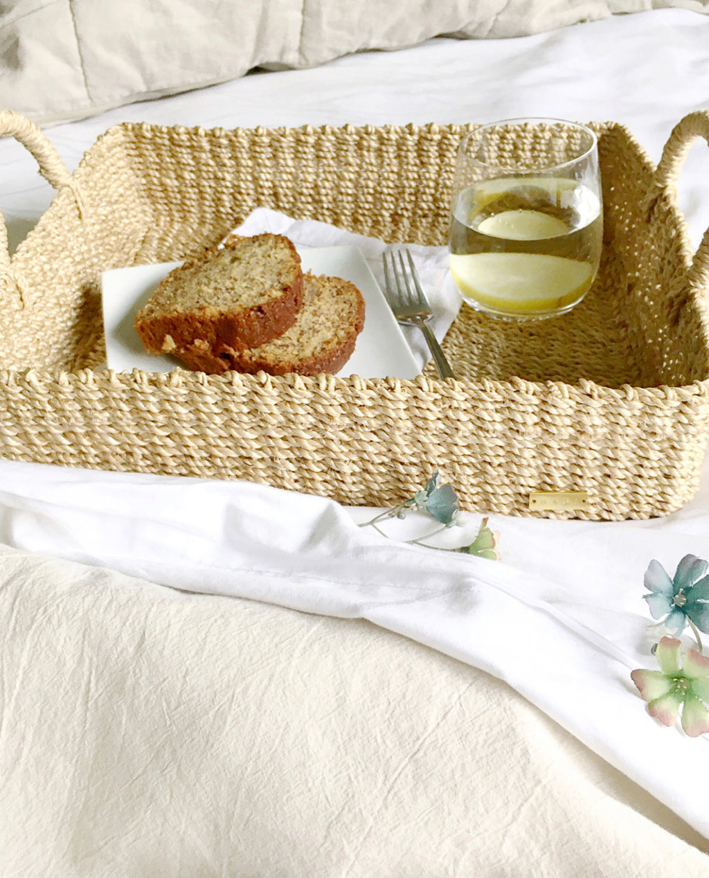Elevate your home organization with the Stephanie Trays Set of 2. Handwoven from 100% natural plant fiber, these eco-friendly trays offer chic and sustainable storage solutions for any room, enhancing your decor with natural elegance.