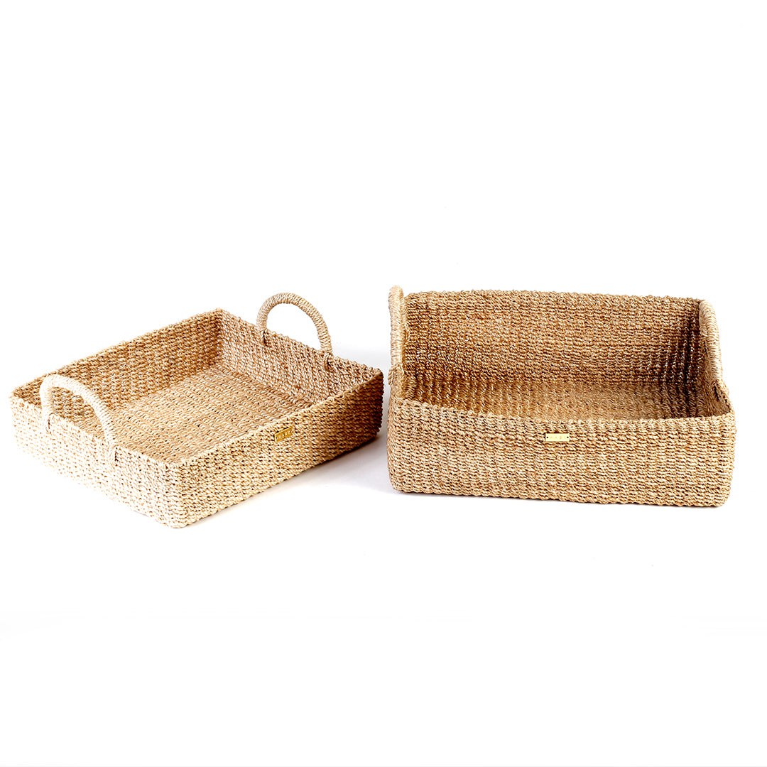 Elevate your home organization with the Stephanie Trays Set of 2. Handwoven from 100% natural plant fiber, these eco-friendly trays offer chic and sustainable storage solutions for any room, enhancing your decor with natural elegance.