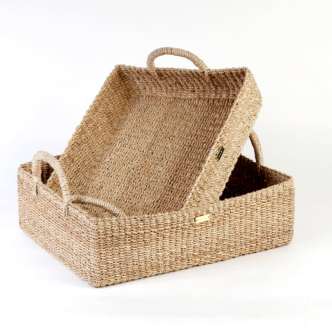Elevate your home organization with the Stephanie Trays Set of 2. Handwoven from 100% natural plant fiber, these eco-friendly trays offer chic and sustainable storage solutions for any room, enhancing your decor with natural elegance.